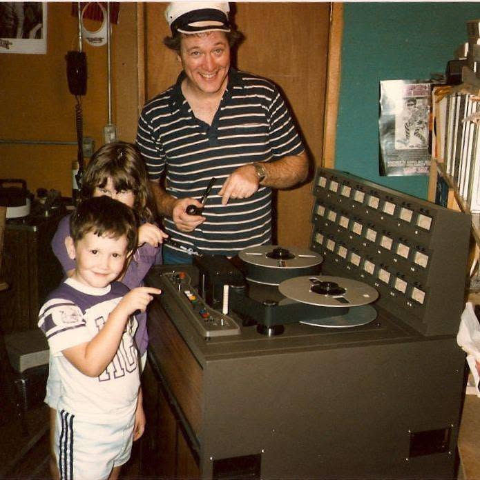 Wes as a child with his father at a reel-to-reel tape machine